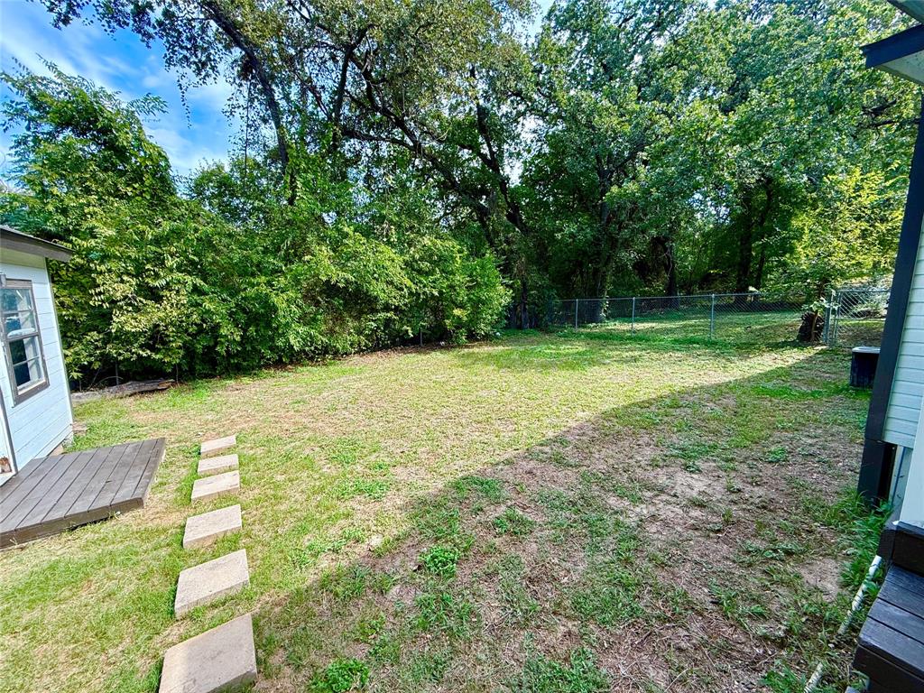 532 Marquette Avenue Azle, TX 76020 - Photo 10 of 32 a view of a backyard with a garden