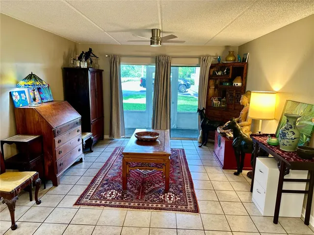a living room with furniture and a table