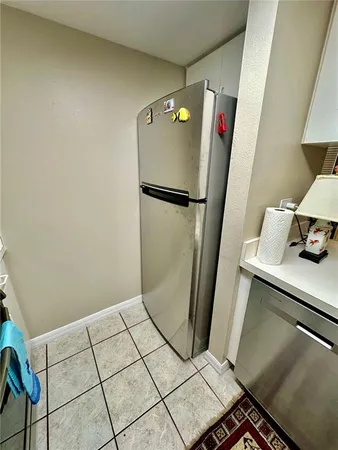 a kitchen with sink stove and cabinets