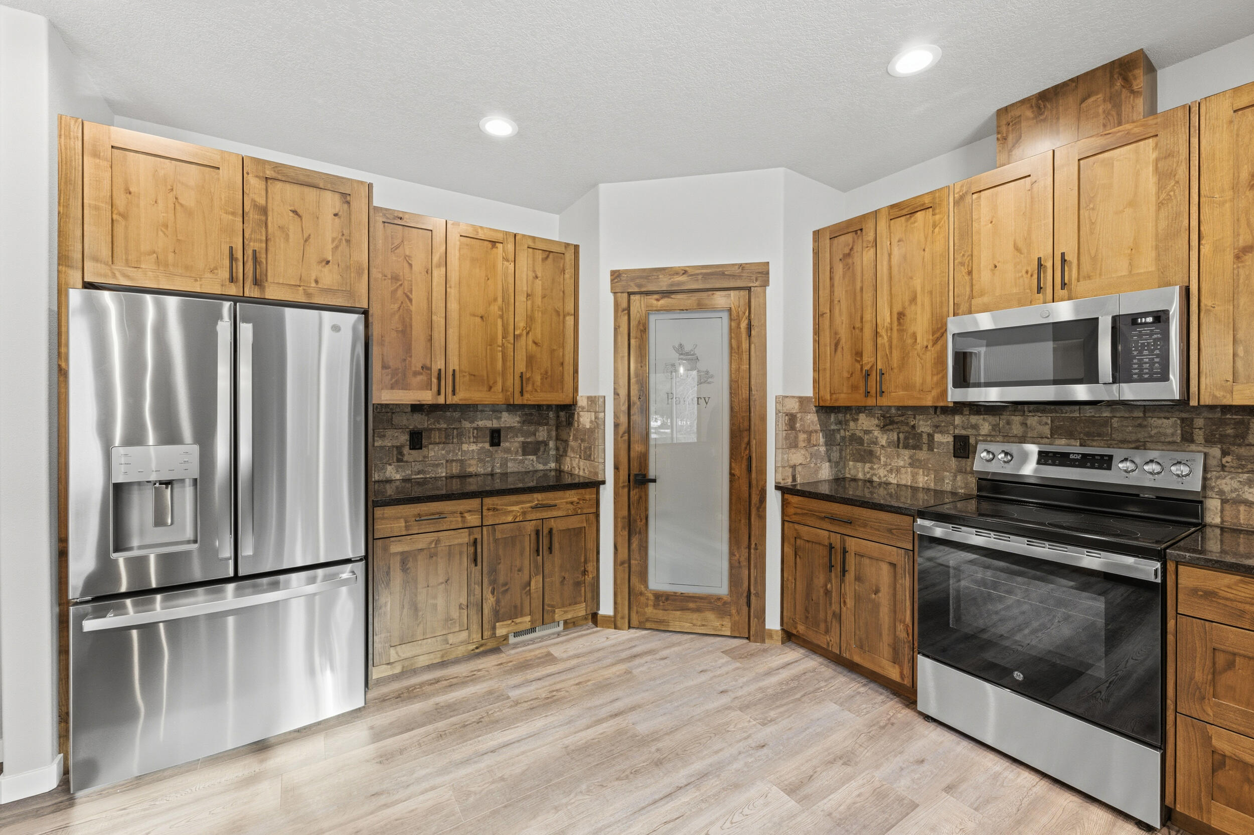 16083 Dyke Road, Unit 9 La Pine, OR 97739 - Photo 14 of 53 a kitchen with a refrigerator sink and microwave