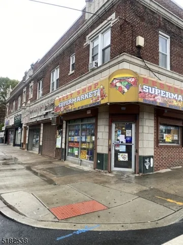 a view of a building with retail shops