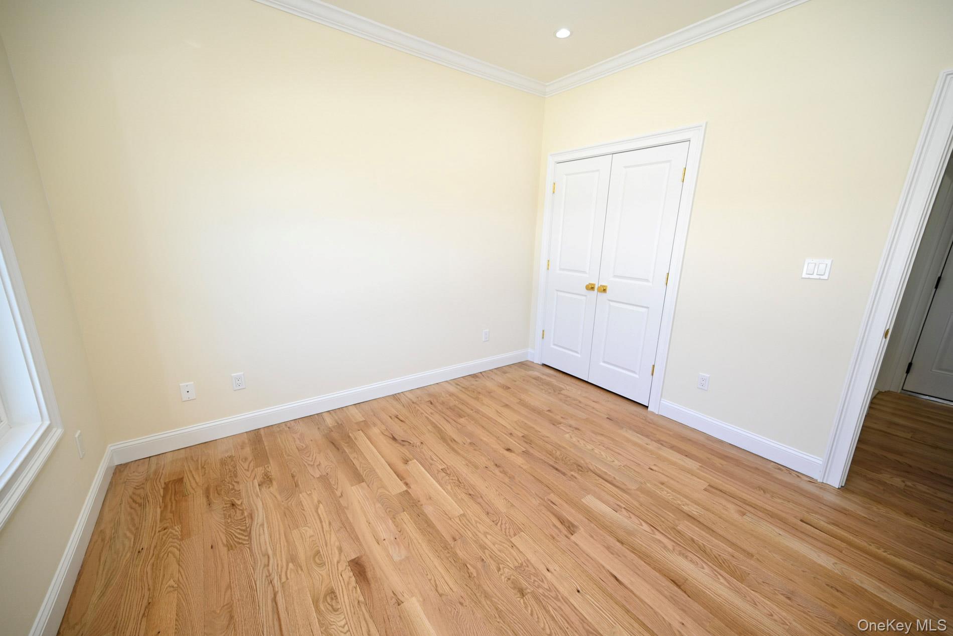 1772 Rose Street Merrick, NY 11566 - Photo 9 of 35 a view of empty room with wooden floor