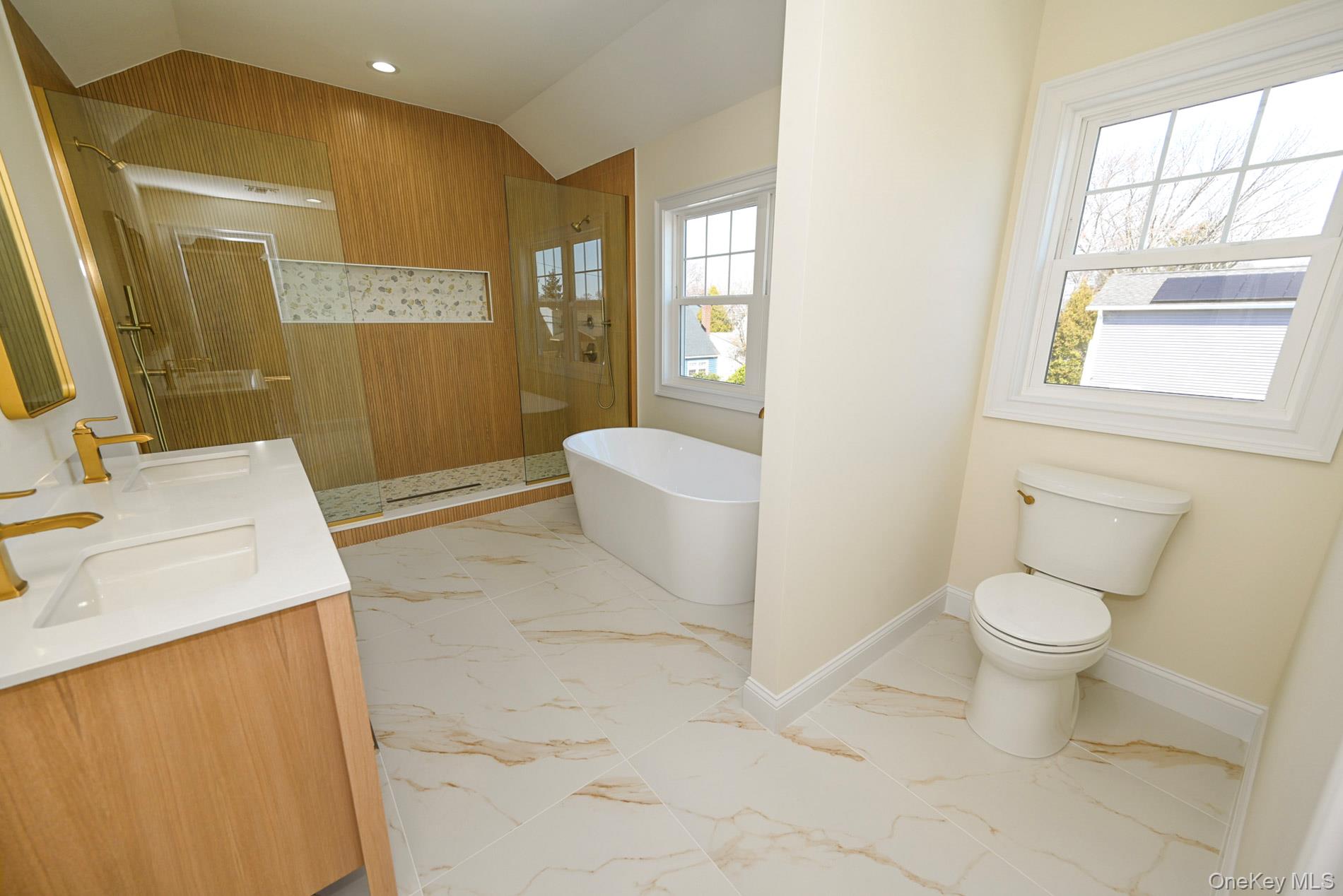 1772 Rose Street Merrick, NY 11566 - Photo 15 of 35 a bathroom with a sink a toilet and shower
