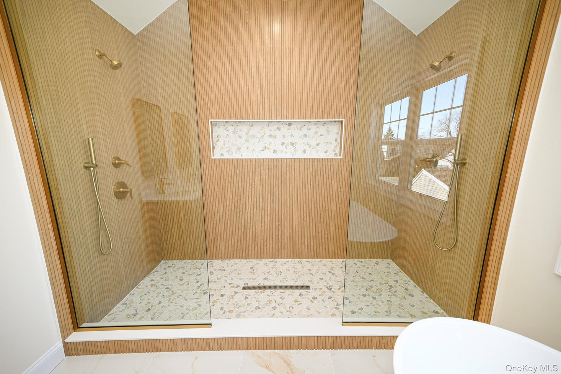 1772 Rose Street Merrick, NY 11566 - Photo 16 of 35 a bathroom with a shower toilet and sink