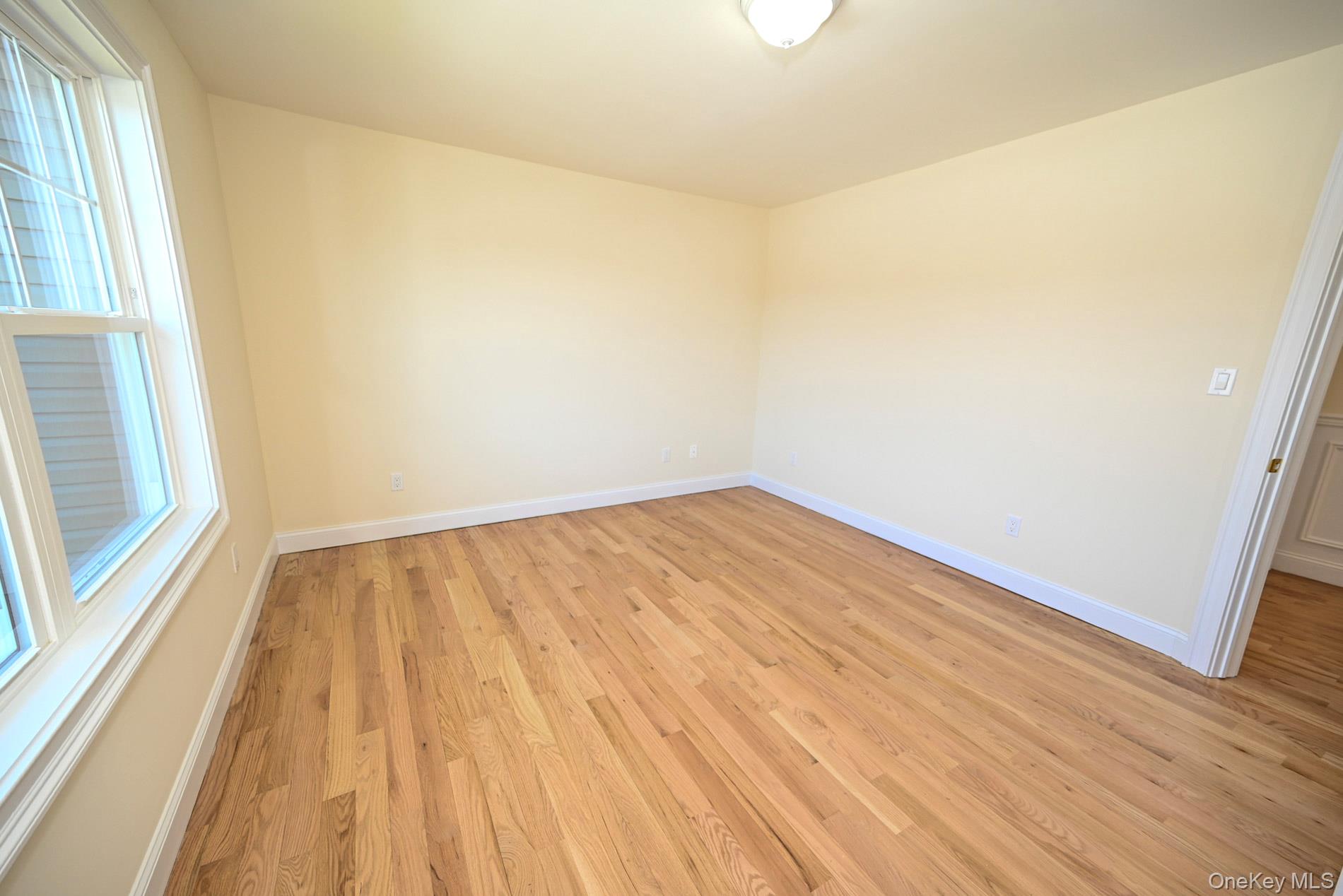 1772 Rose Street Merrick, NY 11566 - Photo 18 of 35 a view of wooden floor in a room