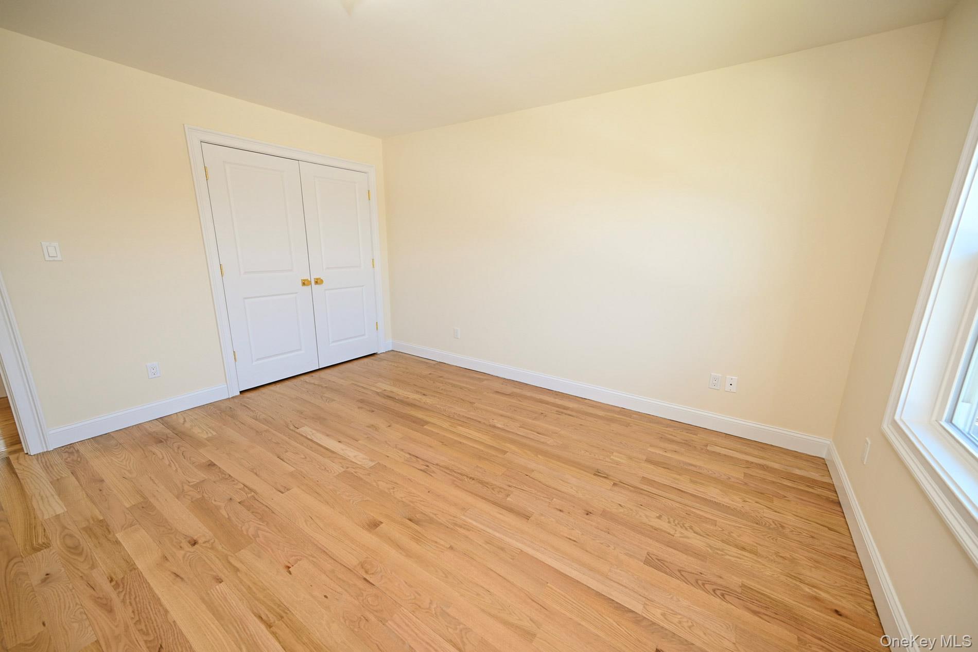 1772 Rose Street Merrick, NY 11566 - Photo 21 of 35 a view of empty room with wooden floor