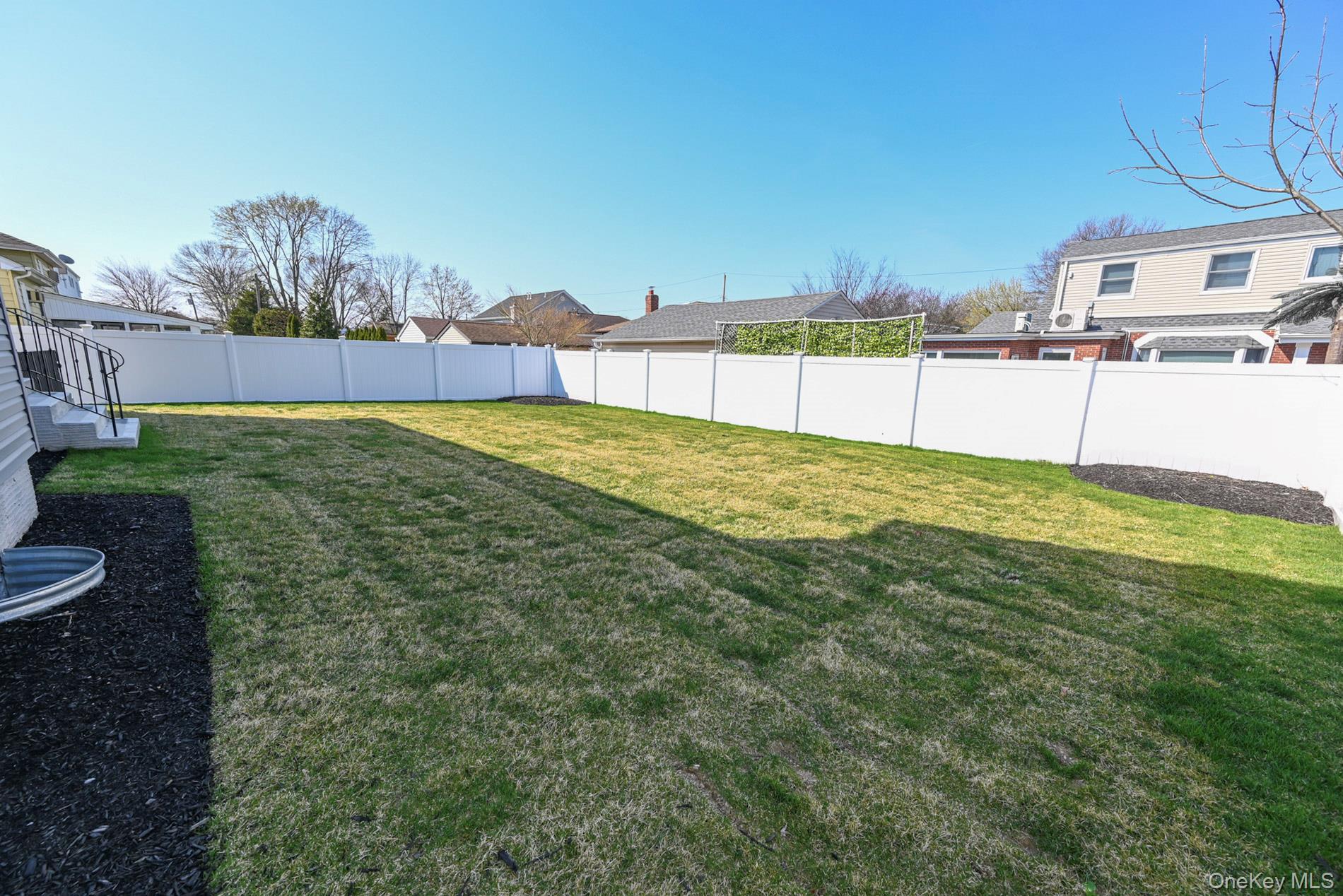 1772 Rose Street Merrick, NY 11566 - Photo 28 of 35 a view of an house with backyard and road
