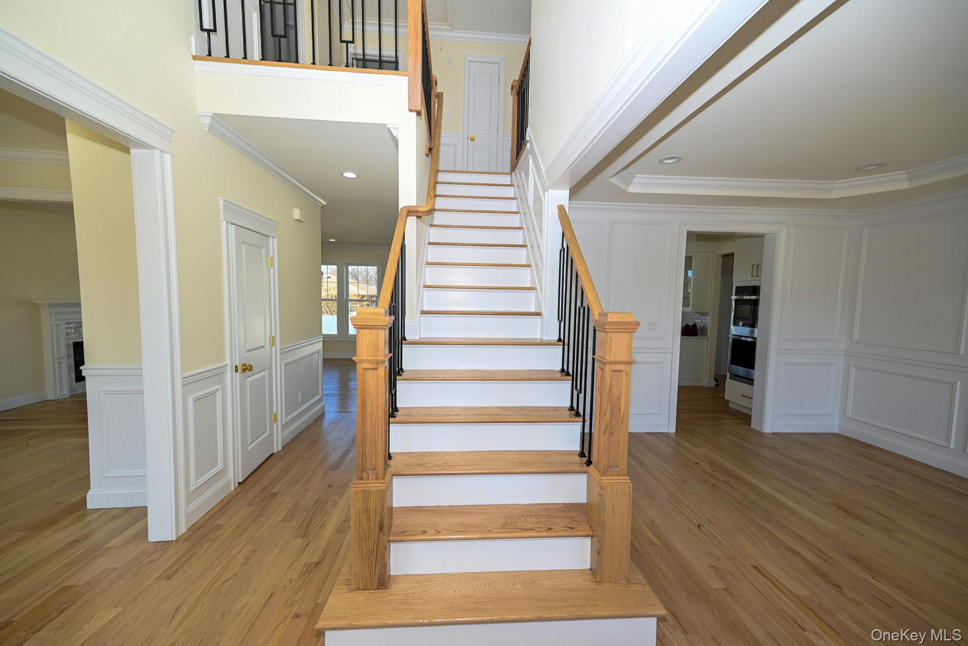 1772 Rose Street Merrick, NY 11566 - Photo 3 of 35 a view of a hallway with wooden floor and windows