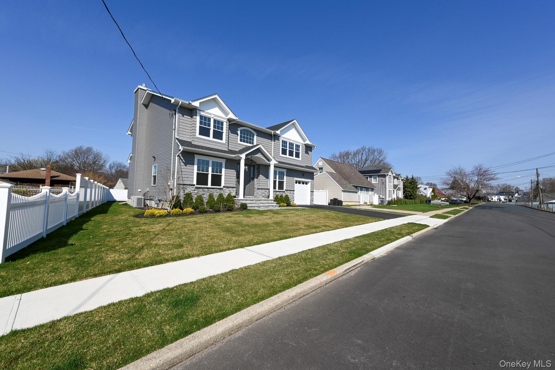 1772 Rose Street Merrick, NY 11566 - Photo 31 of 35 a front view of a house with a yard