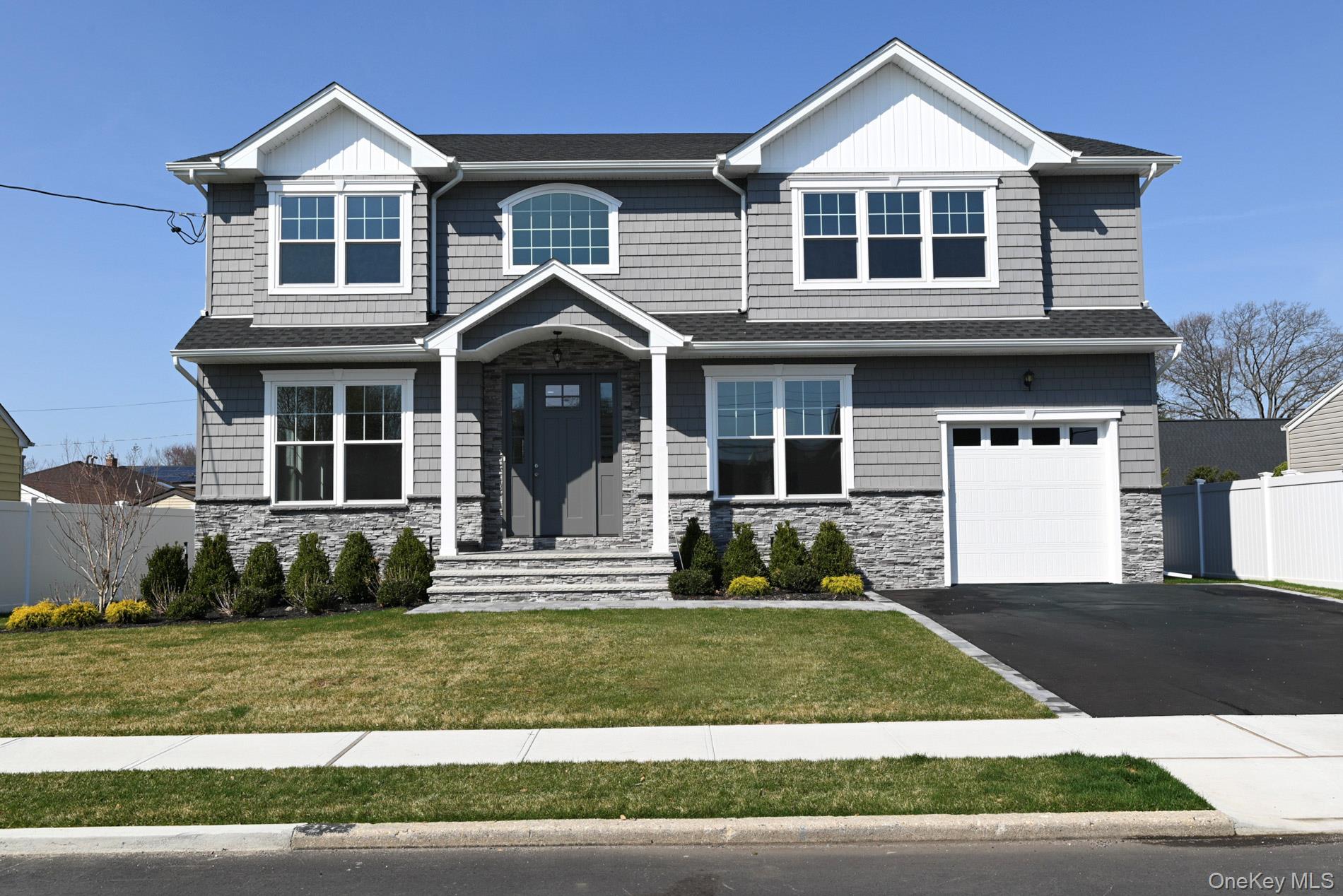 1772 Rose Street Merrick, NY 11566 - Photo 32 of 35 a front view of a house with a yard