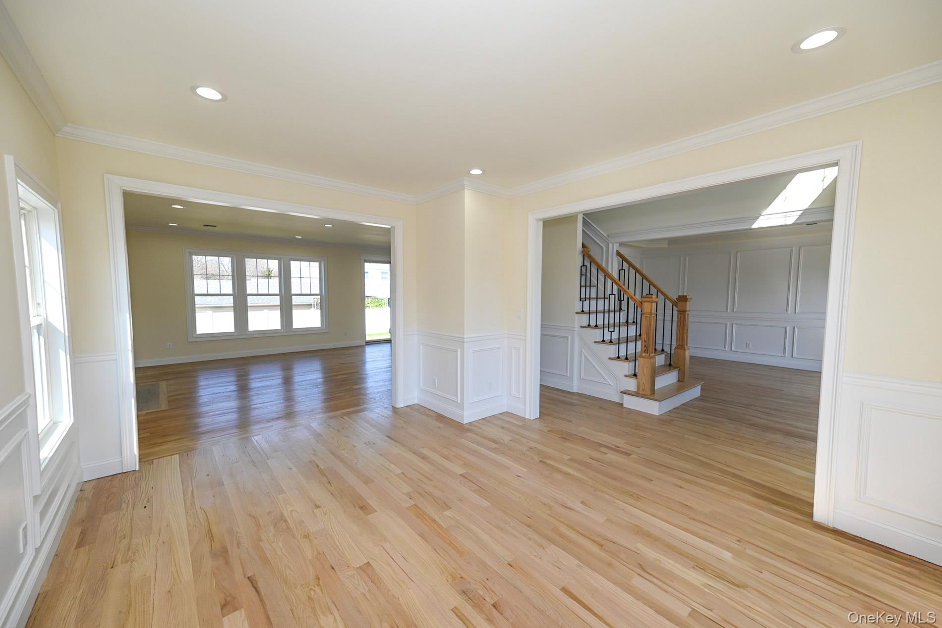 1772 Rose Street Merrick, NY 11566 - Photo 4 of 35 an empty room with wooden floor and windows