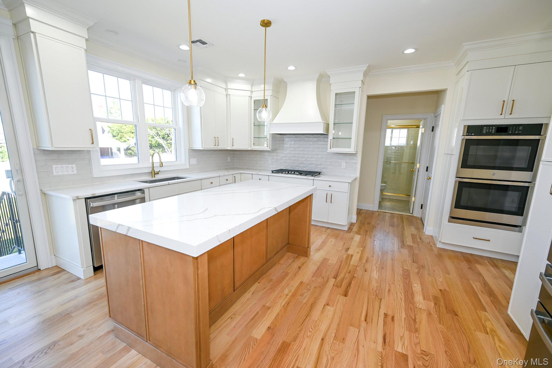 1772 Rose Street Merrick, NY 11566 - Photo 6 of 35 a kitchen with a sink stove and refrigerator