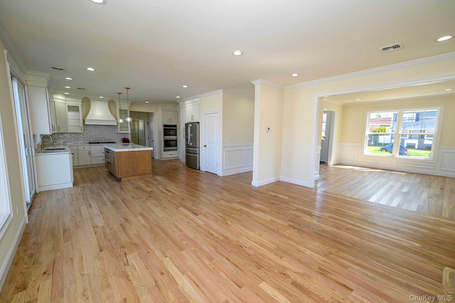 1772 Rose Street Merrick, NY 11566 - Photo 35 of 35 a view of a kitchen with kitchen island wooden floors wooden floor and center island