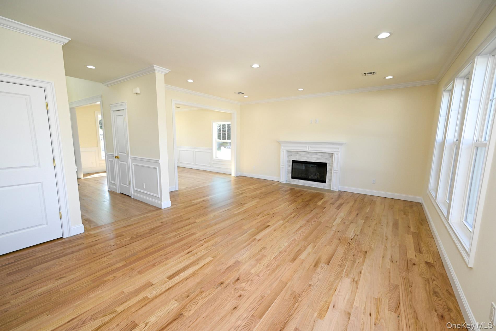 1772 Rose Street Merrick, NY 11566 - Photo 8 of 35 wooden floor in an empty room with a kitchen