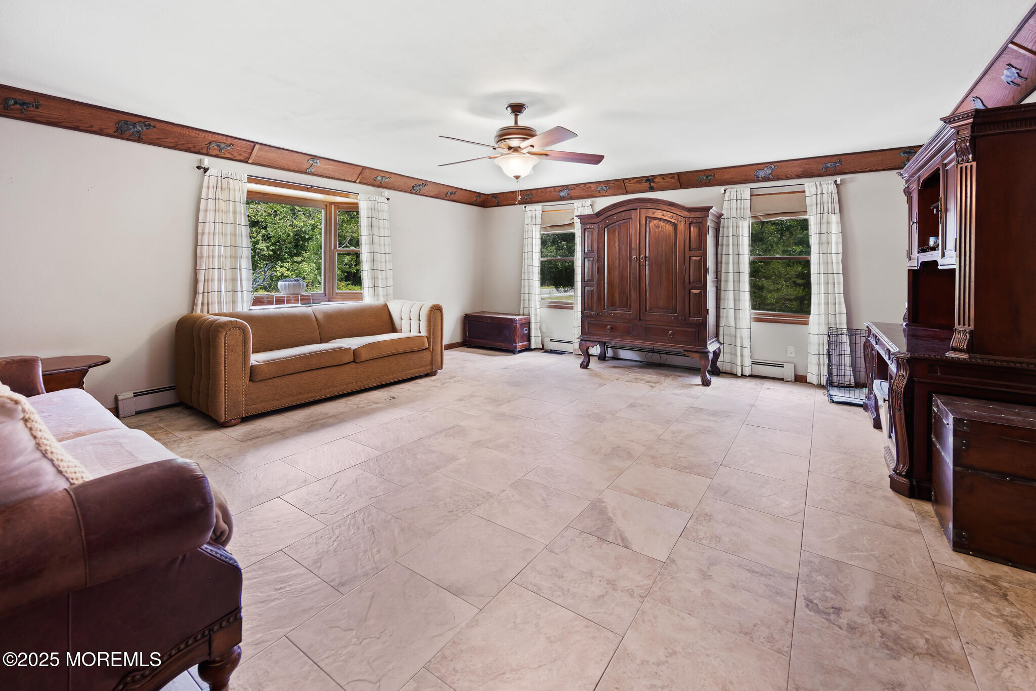 1069 East Veterans Highway Jackson, NJ 08527 - Photo 15 of 65 a living room with furniture a flat screen tv and a large window
