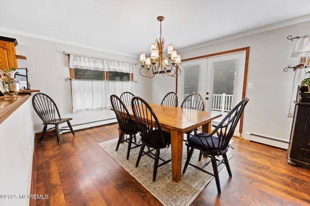 a bedroom with a bed and a mirror on dresser