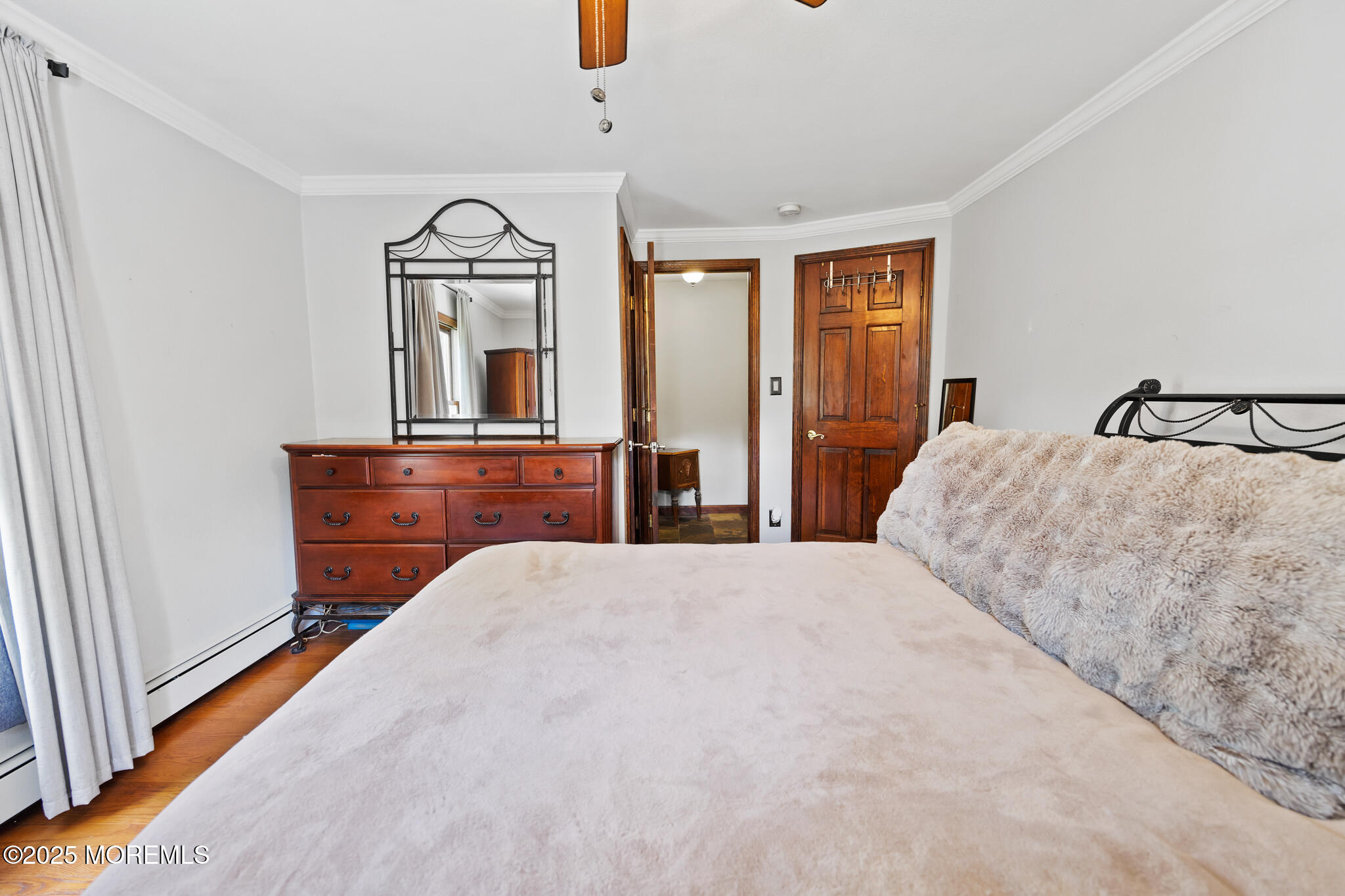 1069 East Veterans Highway Jackson, NJ 08527 - Photo 28 of 65 a bedroom with a bed and a mirror on dresser