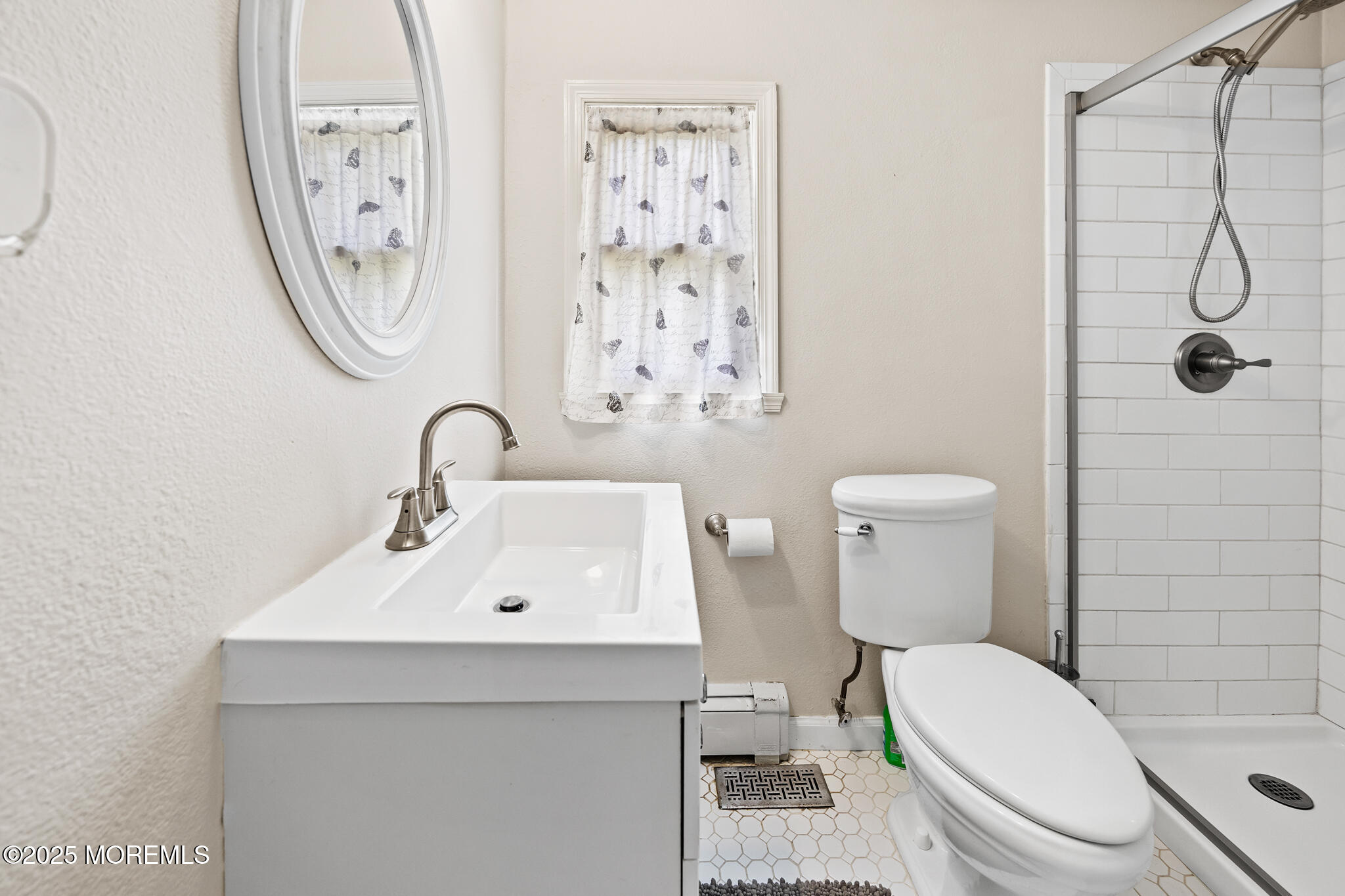 1069 East Veterans Highway Jackson, NJ 08527 - Photo 30 of 65 a bathroom with a toilet sink and a mirror