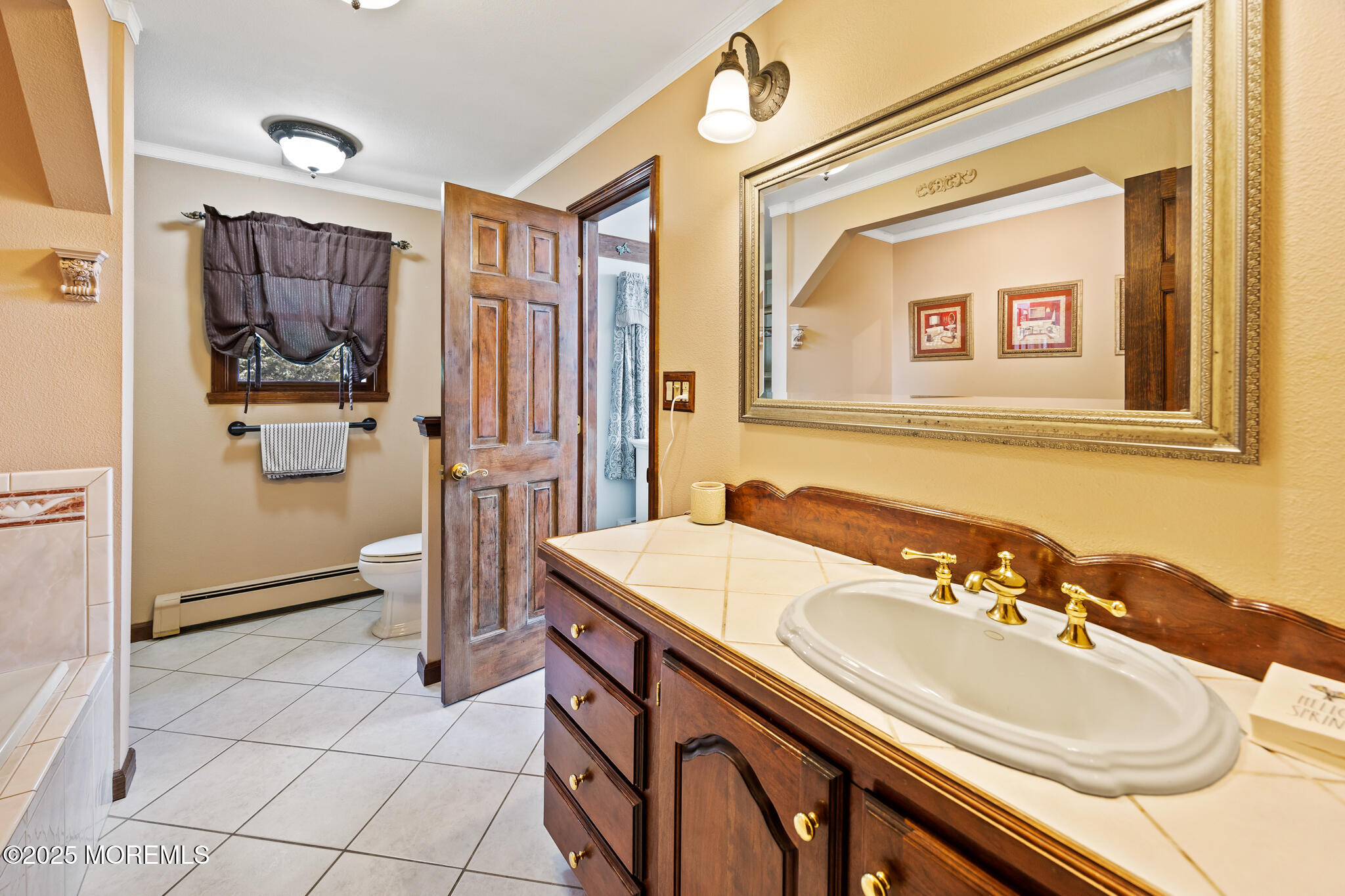 1069 East Veterans Highway Jackson, NJ 08527 - Photo 40 of 65 a bathroom with a sink a mirror and a shower