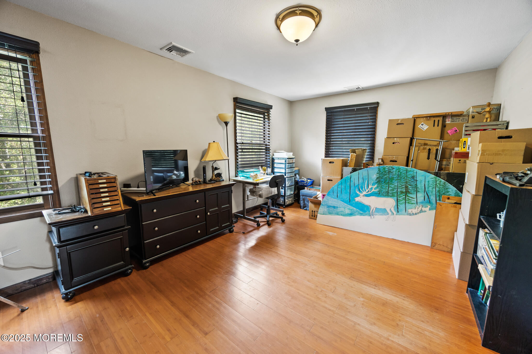 1069 East Veterans Highway Jackson, NJ 08527 - Photo 43 of 65 a living room with furniture and a flat screen tv