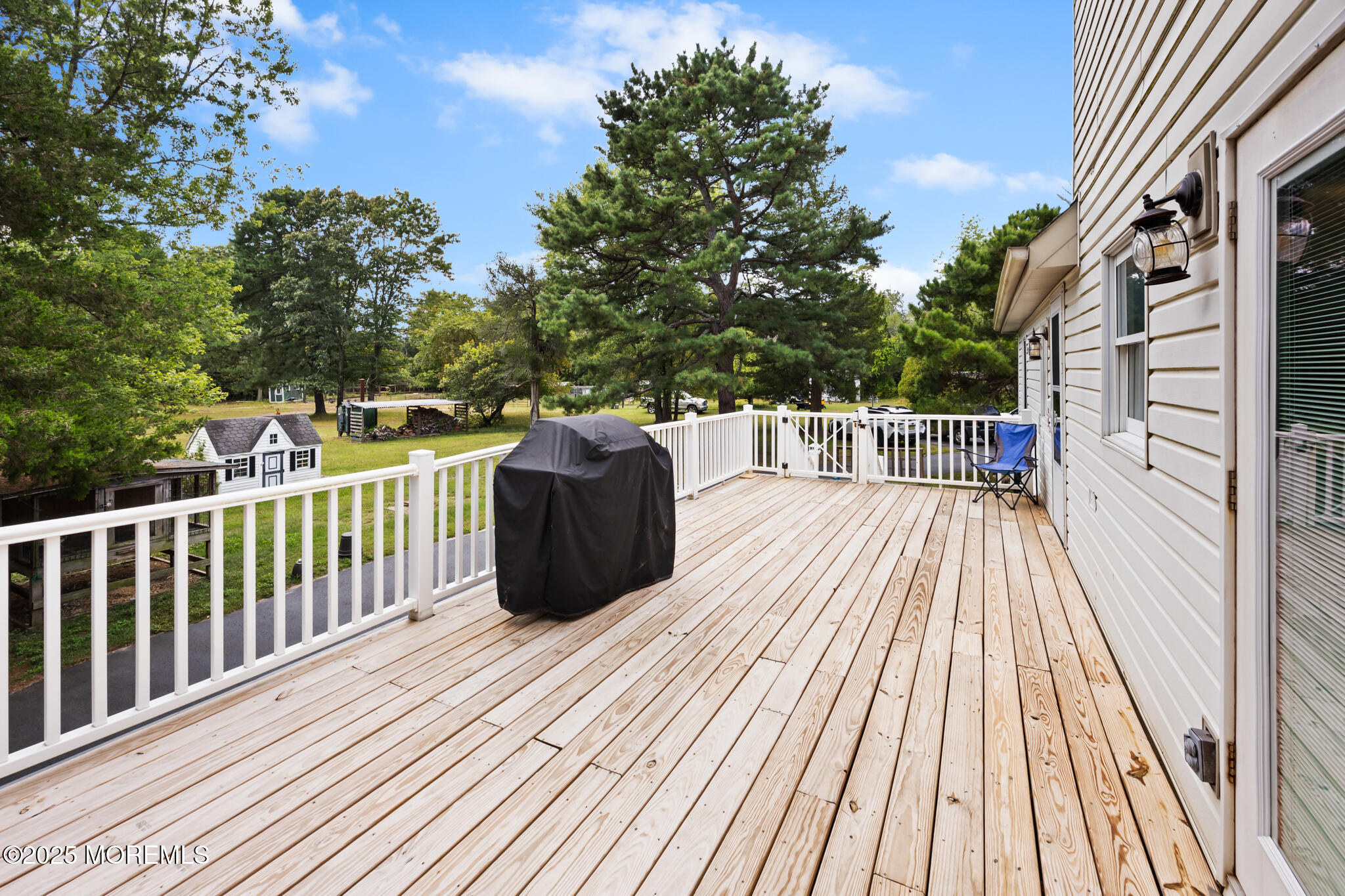 1069 East Veterans Highway Jackson, NJ 08527 - Photo 49 of 65 a view of a roof deck with wooden floor and fence