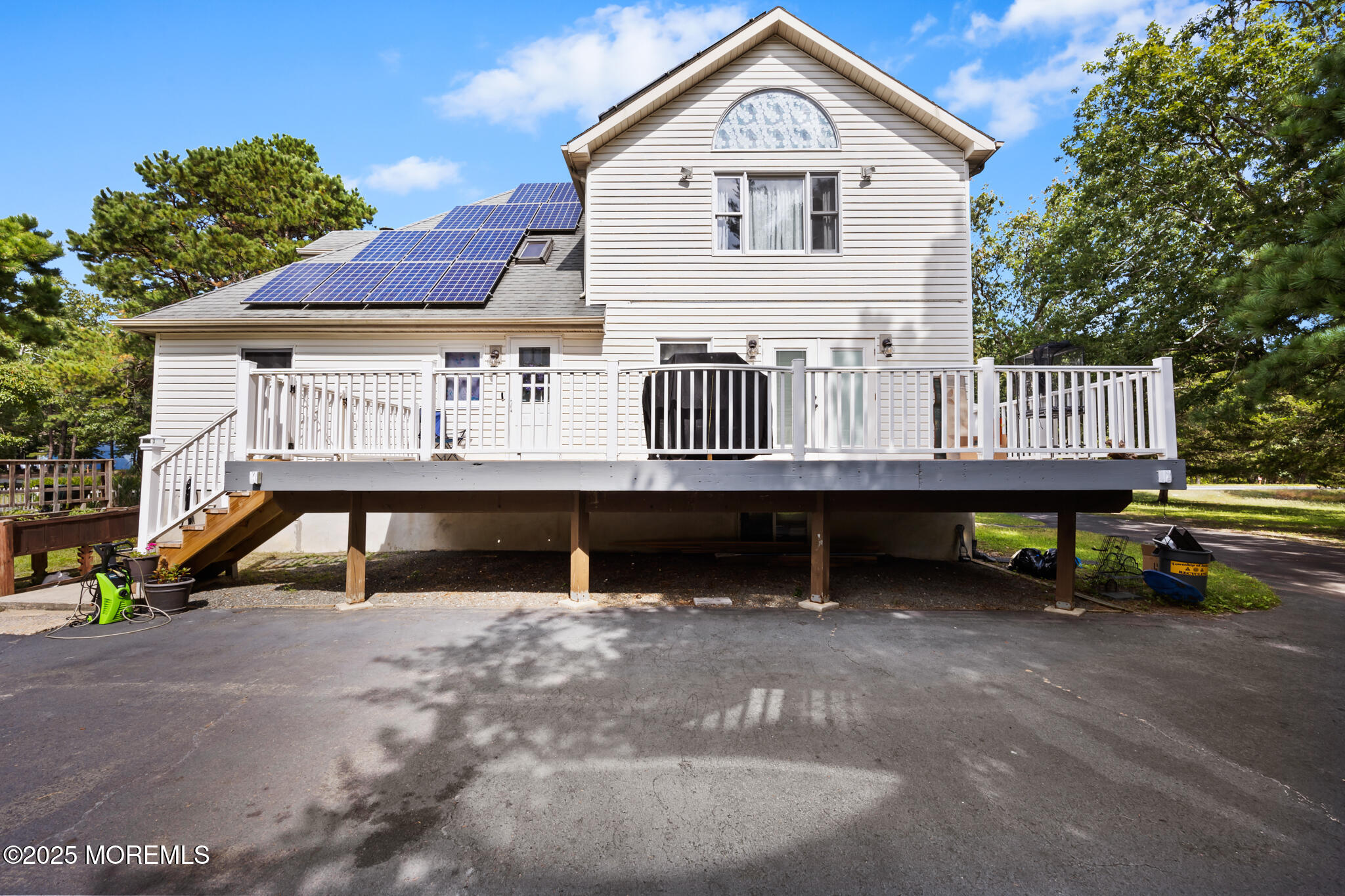 1069 East Veterans Highway Jackson, NJ 08527 - Photo 51 of 65 a view of a house with a wooden deck and furniture