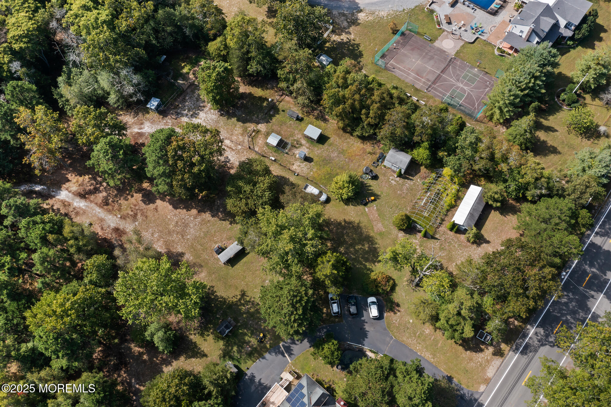 1069 East Veterans Highway Jackson, NJ 08527 - Photo 55 of 65 an aerial view of residential house with outdoor space and trees all around