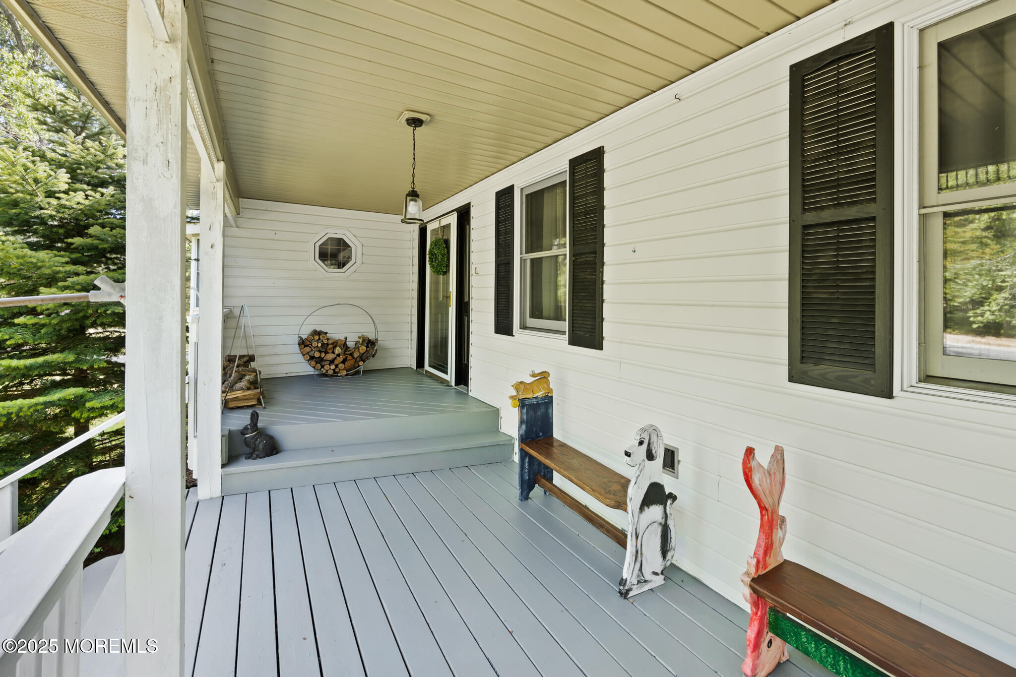 1069 East Veterans Highway Jackson, NJ 08527 - Photo 8 of 65 a backyard of a house with seating space and trees