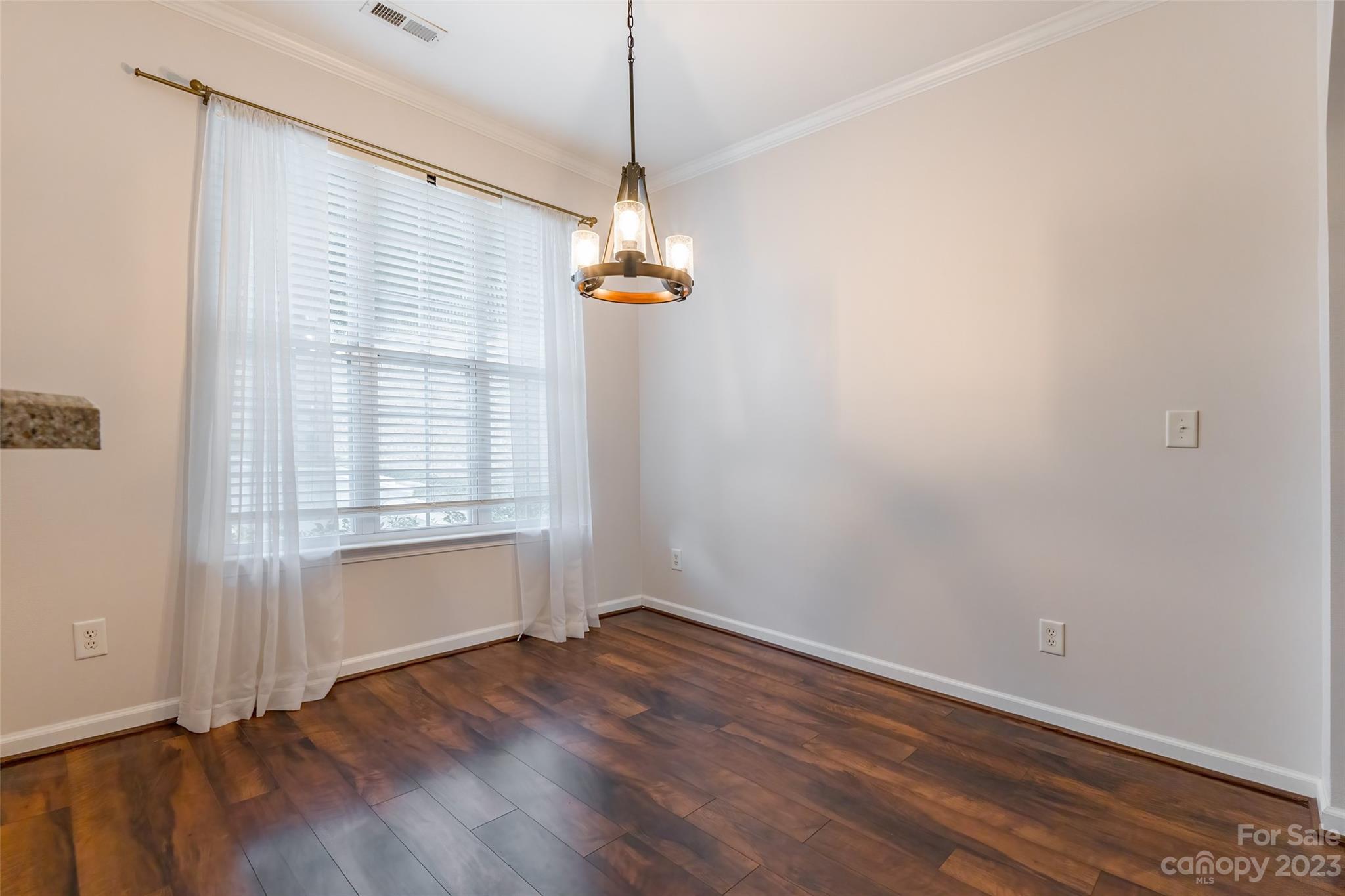 903 Copperstone Lane Fort Mill, SC 29708 - Photo 4 of 17 wooden floor in an empty room with a window