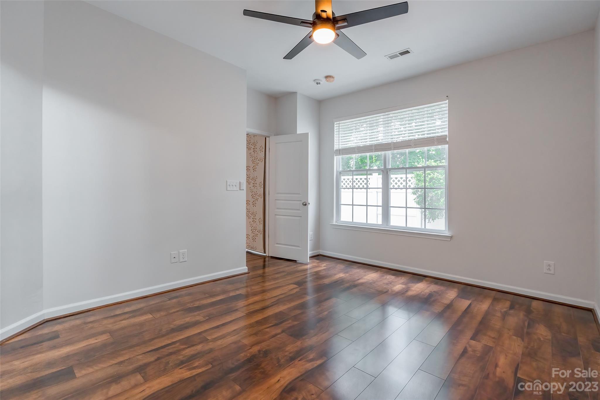 903 Copperstone Lane Fort Mill, SC 29708 - Photo 7 of 17 wooden floor in an empty room with a window