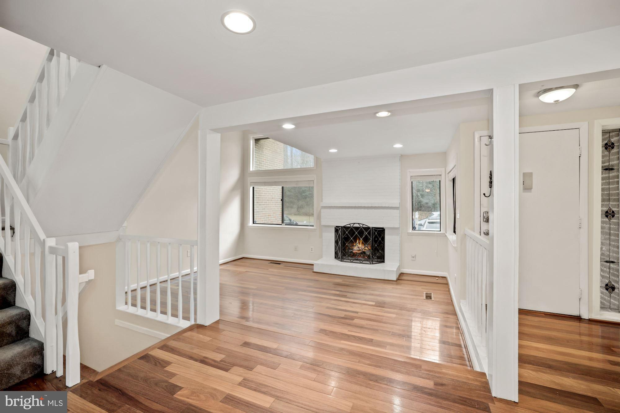 2158 Glencourse Lane Reston, VA 20191 - Photo 1 of 31 Foyer and living room with fireplace