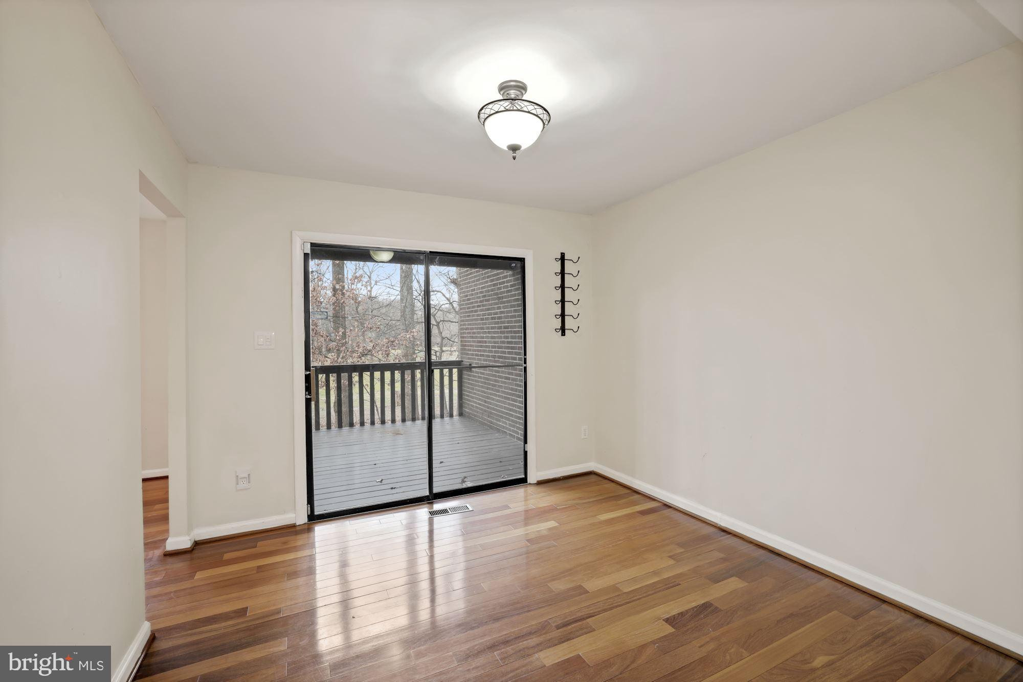 2158 Glencourse Lane Reston, VA 20191 - Photo 6 of 31 Dining room with deck and golf course view