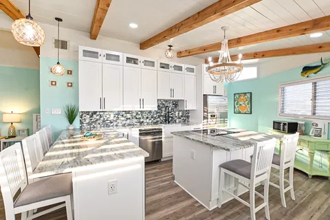 a kitchen with a sink stove and wooden cabinets