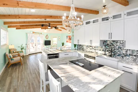 a kitchen with a sink stove and cabinets