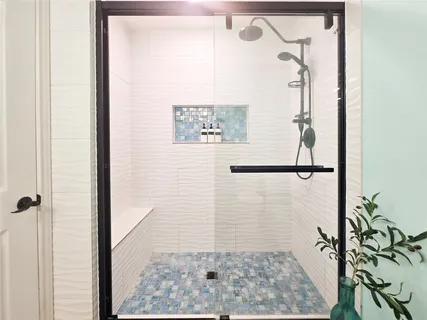 a bathroom with a toilet a sink and a mirror