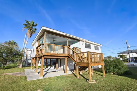 a view of a lake with houses in the back