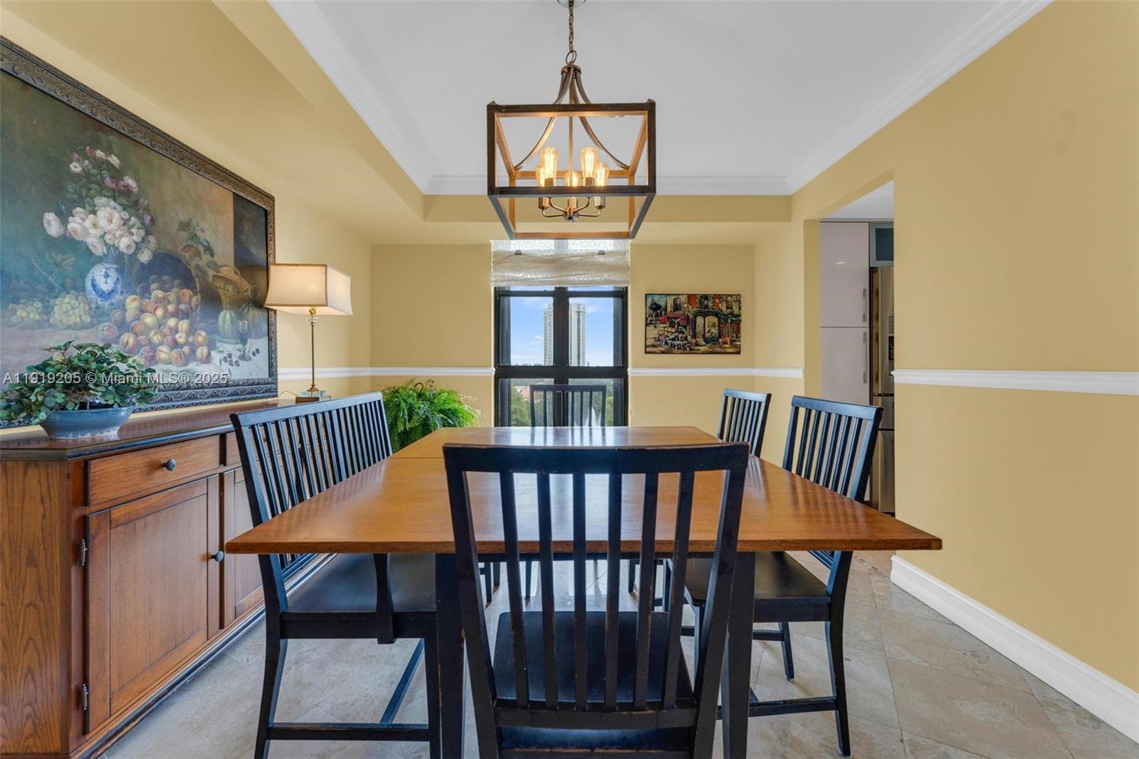 2000 Towerside Terrace, Unit 702 Miami, FL 33138 - Photo 11 of 37 a view of a dining room with furniture window and wooden floor