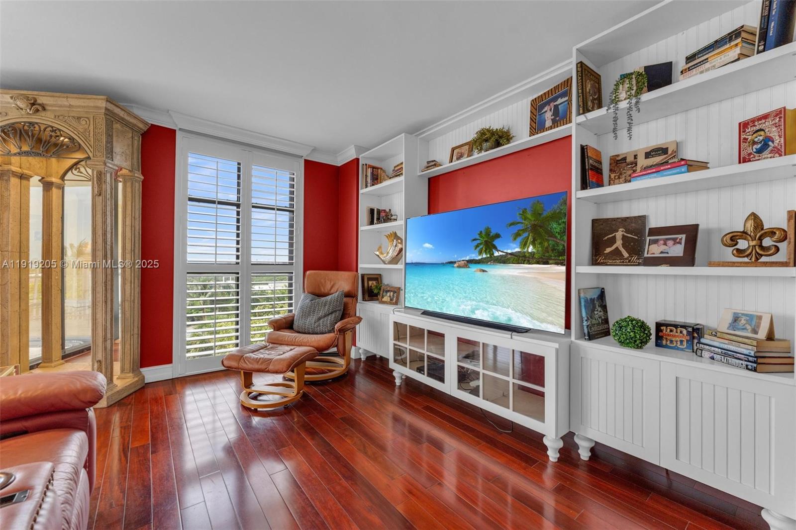 2000 Towerside Terrace, Unit 702 Miami, FL 33138 - Photo 14 of 37 a living room with furniture and a wooden floor