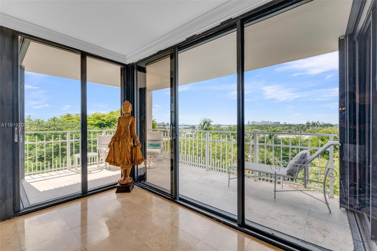 2000 Towerside Terrace, Unit 702 Miami, FL 33138 - Photo 16 of 37 a view of an empty room with wooden floor and door