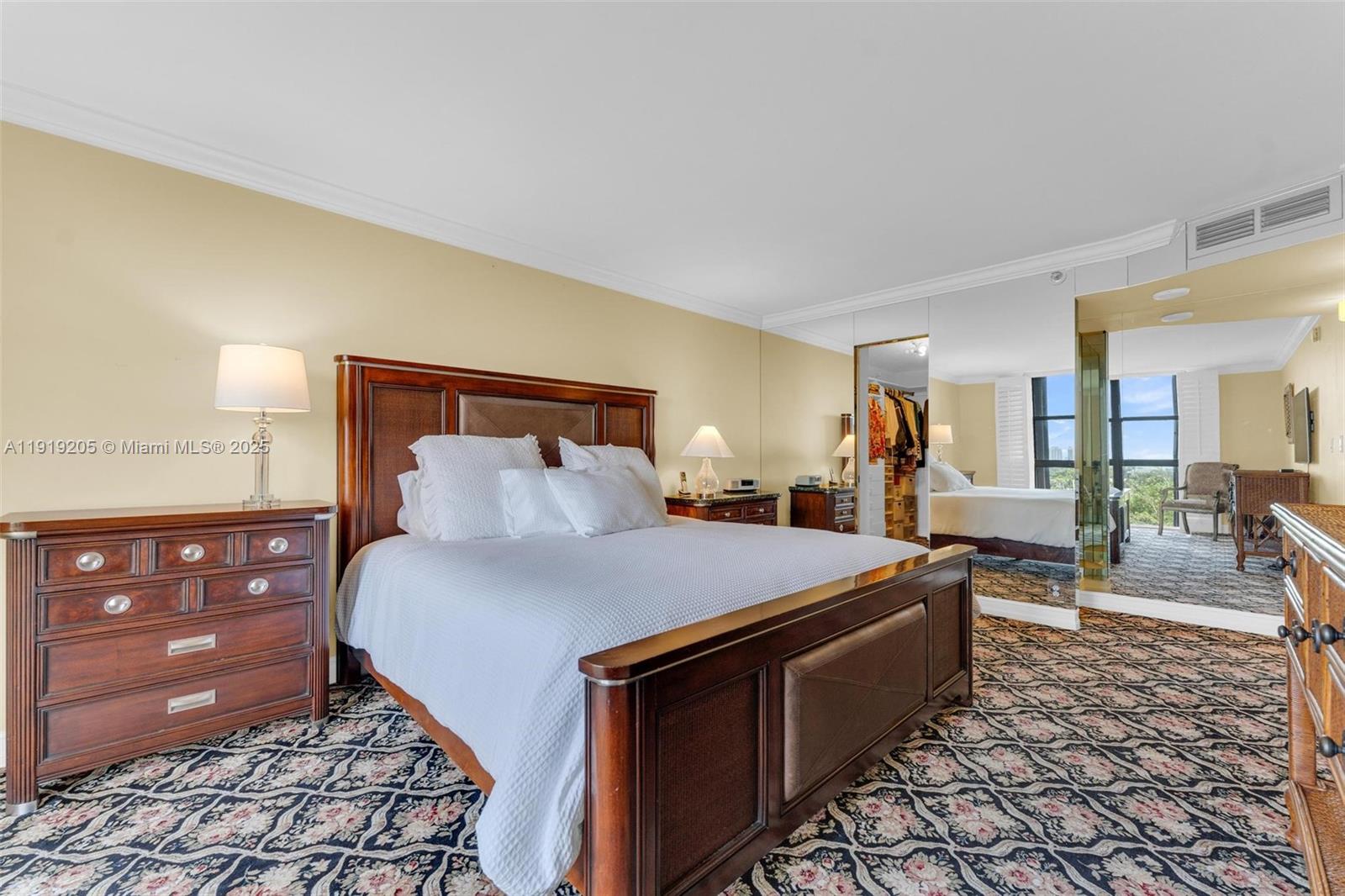 2000 Towerside Terrace, Unit 702 Miami, FL 33138 - Photo 17 of 37 a bed room with a bed and a dresser