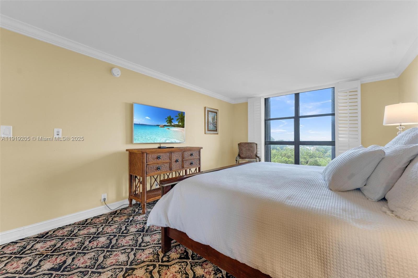 2000 Towerside Terrace, Unit 702 Miami, FL 33138 - Photo 19 of 37 a bedroom with a bed and a window