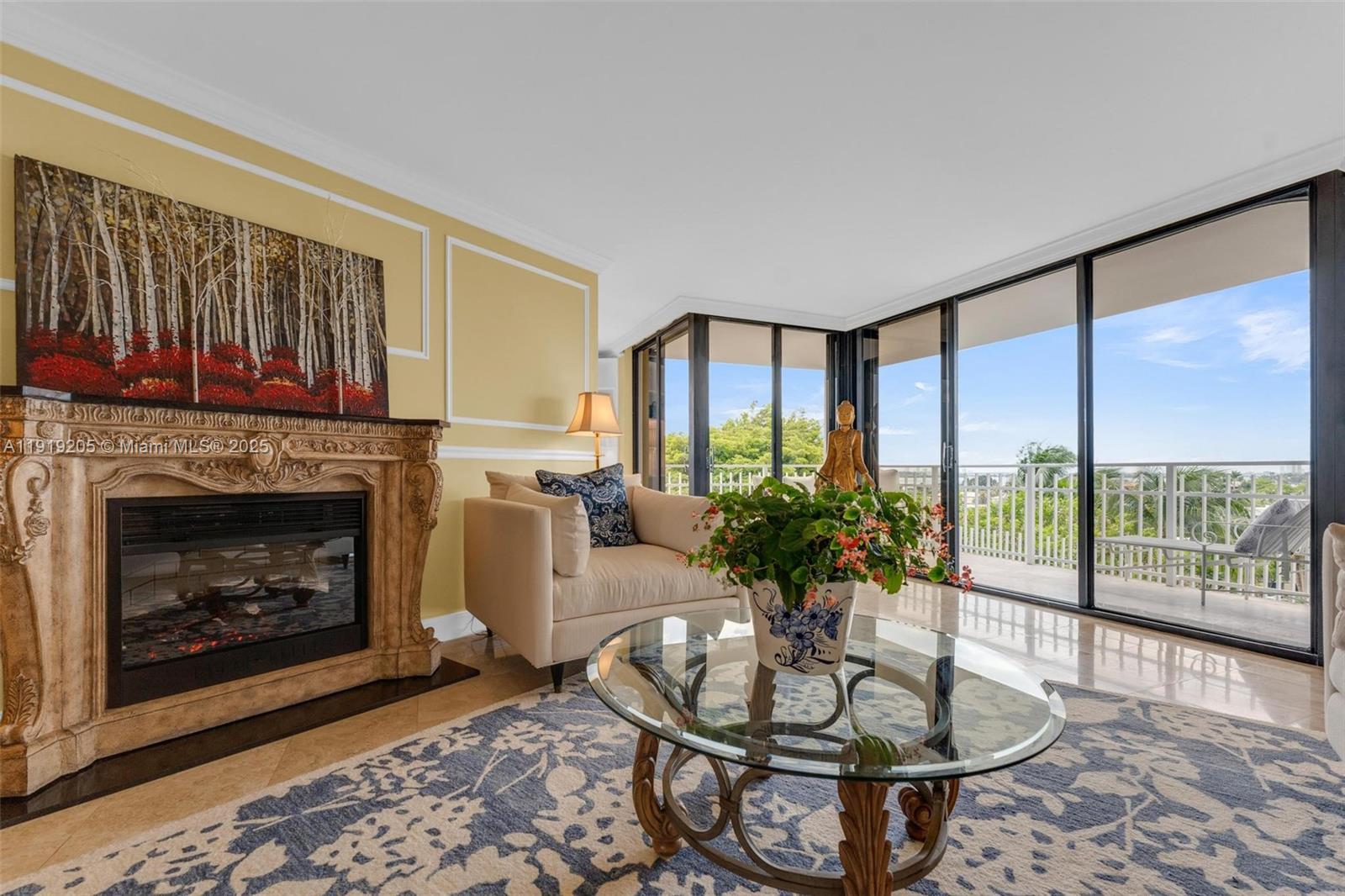2000 Towerside Terrace, Unit 702 Miami, FL 33138 - Photo 2 of 37 a living room with furniture a window and a fireplace