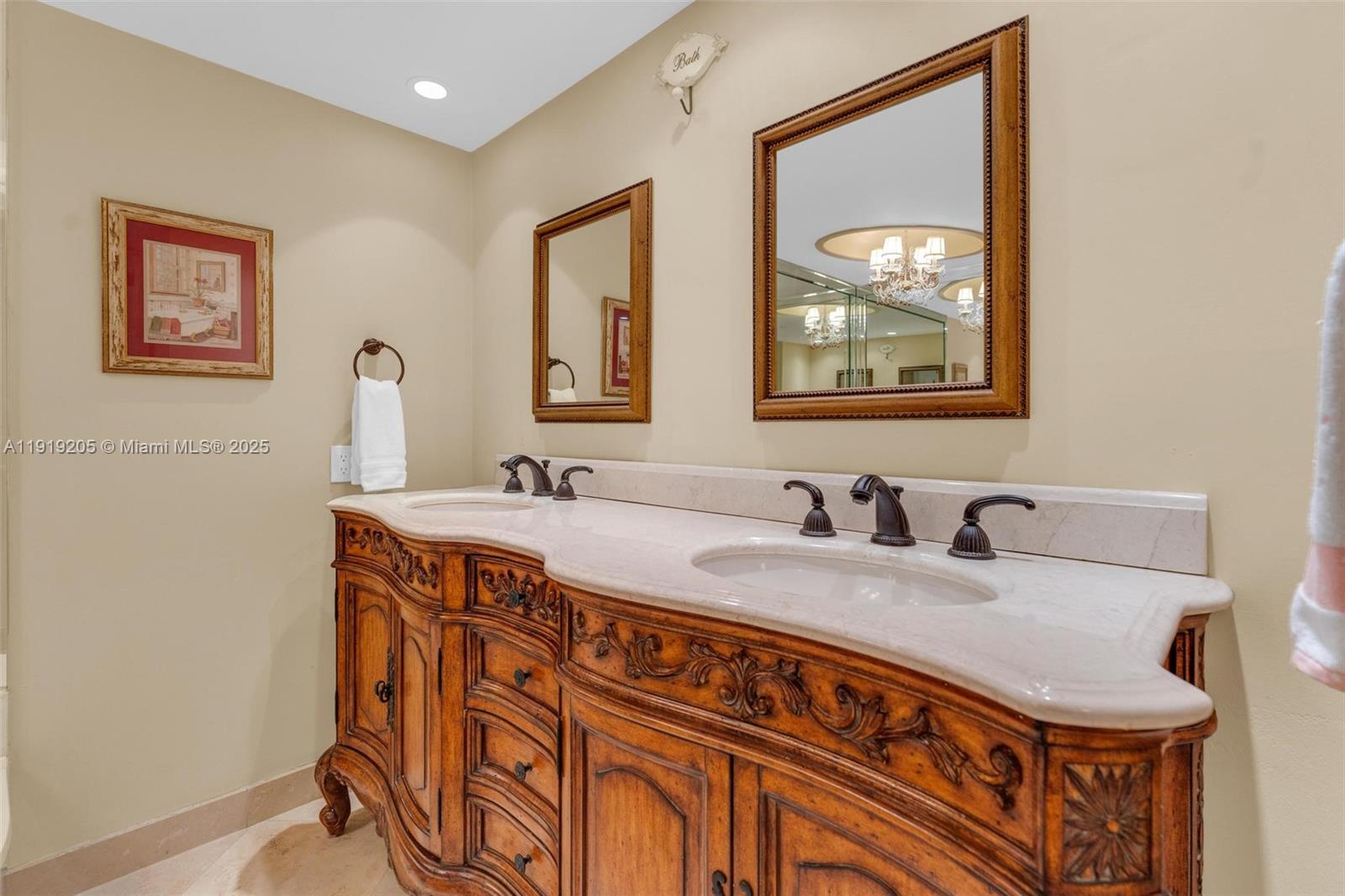 2000 Towerside Terrace, Unit 702 Miami, FL 33138 - Photo 24 of 37 a bathroom with a sink and a mirror
