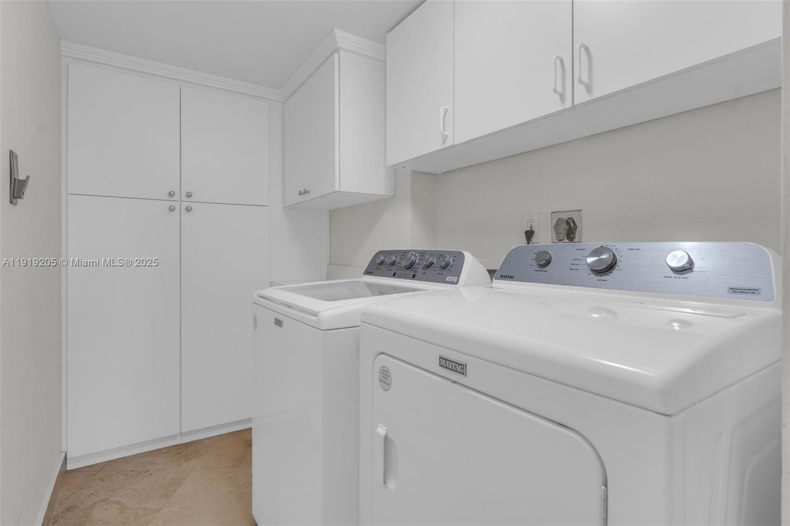 2000 Towerside Terrace, Unit 702 Miami, FL 33138 - Photo 26 of 37 a utility room with dryer and washer