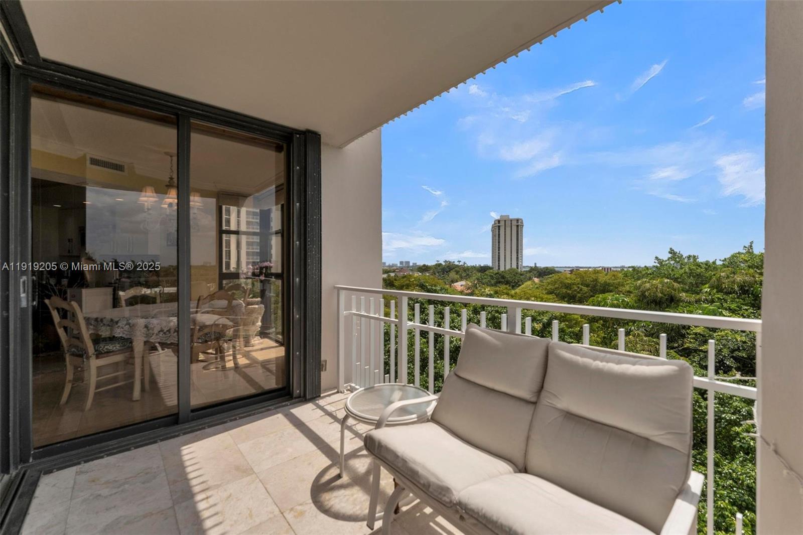 2000 Towerside Terrace, Unit 702 Miami, FL 33138 - Photo 31 of 37 a balcony with furniture and city view