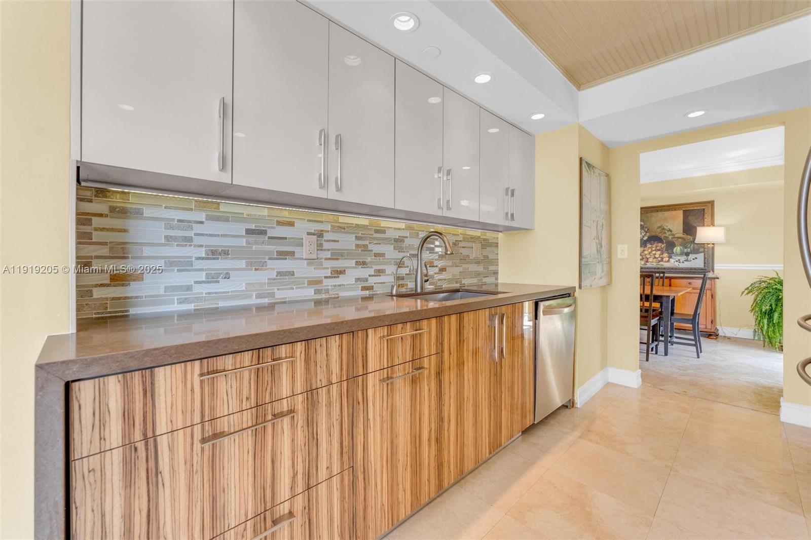 2000 Towerside Terrace, Unit 702 Miami, FL 33138 - Photo 9 of 37 a view of kitchen with wooden floor