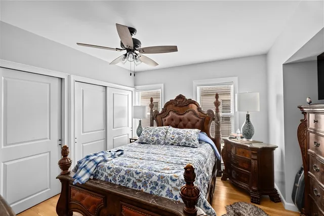 a bedroom with a bed and a walk in closet