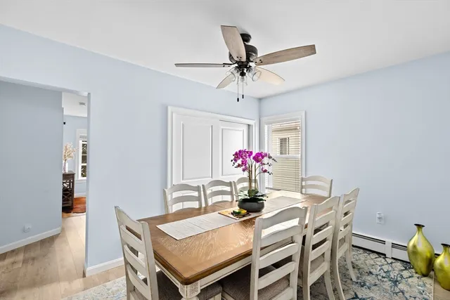 a view of a dining room with furniture and wooden floor