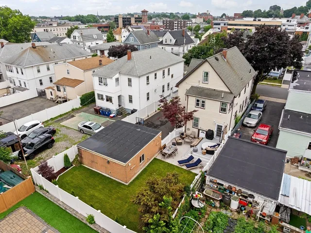 an aerial view of a house with a garden