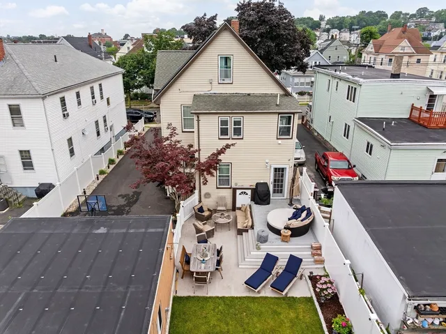 a view of house with yard outdoor seating